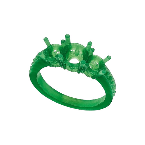 An expert goldsmith hand carving a highly detailed wax model for a custom jewelry design An expert goldsmith hand carving a highly detailed wax model for a custom jewelry design