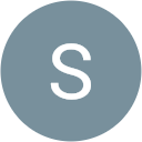 The letter s in a blue circle.