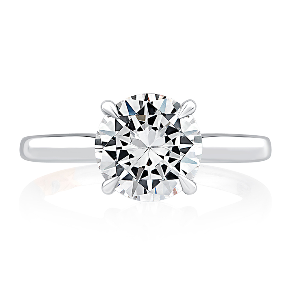 A white gold engagement ring with a brilliant cut diamond.