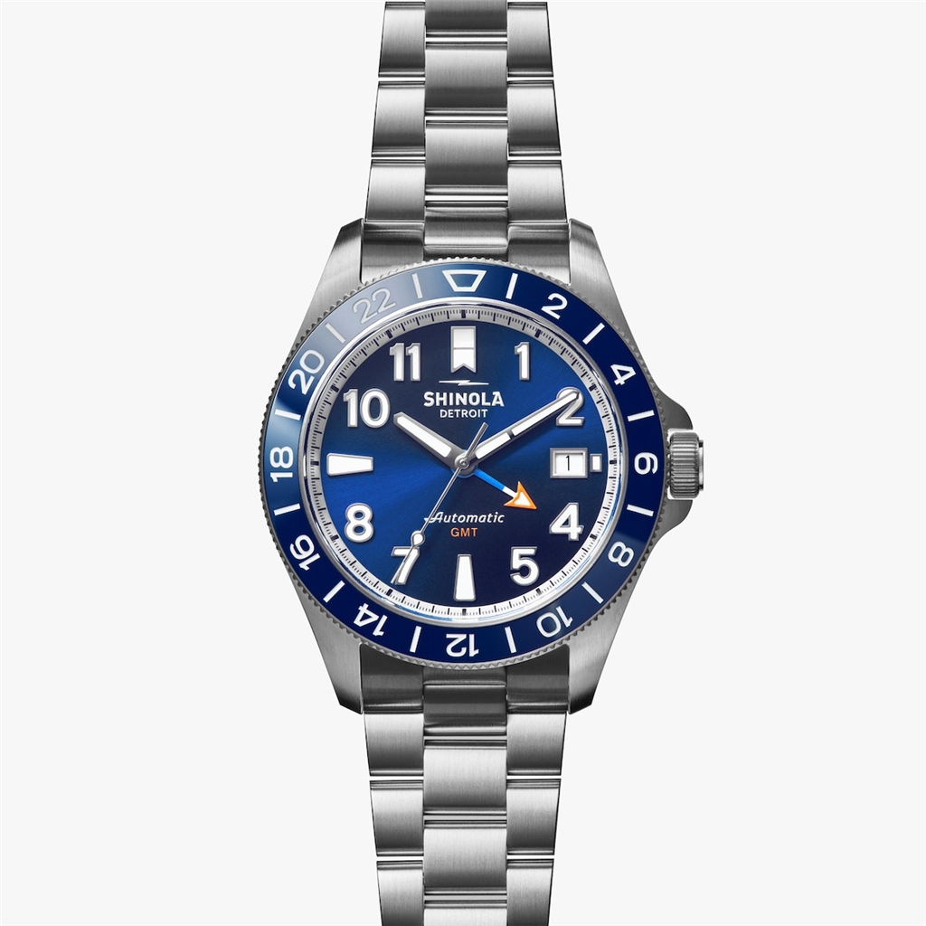 A stainless steel watch with blue dials.