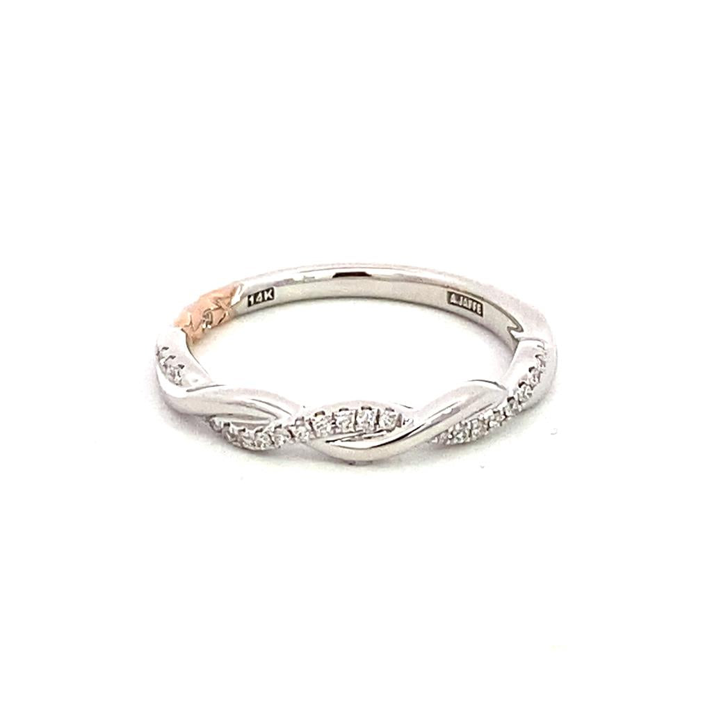 A white gold and diamond band ring.